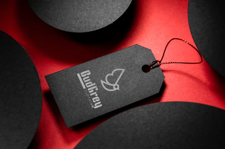 Embossed BudGrey tag on red and black paper