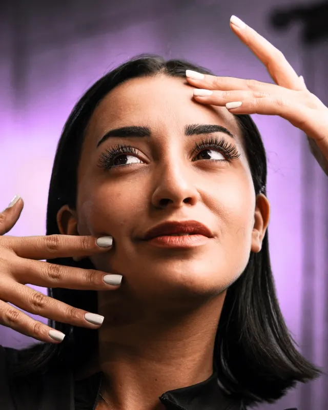 Beauty portrait showing lashes and a manicure, shot for VOG Beauty Salon